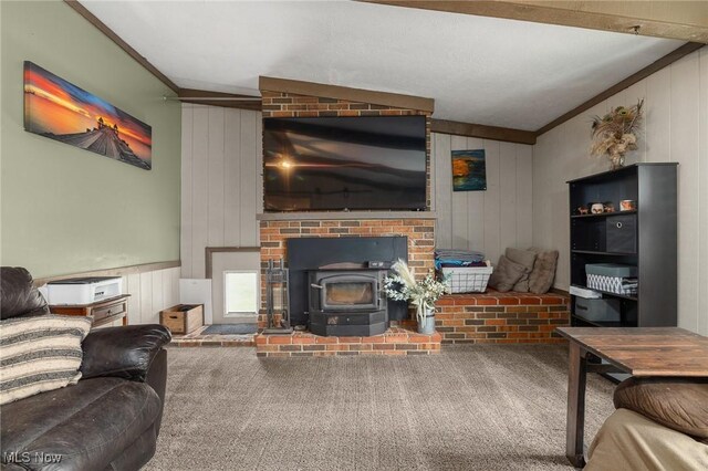 1439 Township Road 593, Ashland, OH 44805 - carpeted living area featuring ornamental molding, a wood stove, and wood walls
