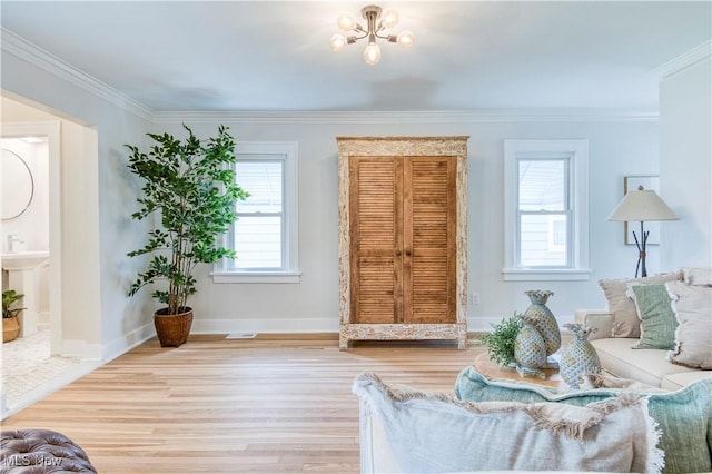 2332 Allison Rd, University Heights, OH 44118 - living room with plenty of natural light, ornamental molding, wood finished floors, a chandelier, and baseboards