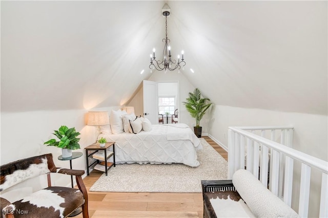 2332 Allison Rd, University Heights, OH 44118 - bedroom featuring wood finished floors, a chandelier, and lofted ceiling