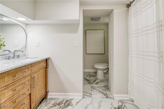2332 Allison Rd, University Heights, OH 44118 - full bath featuring marble look tiles, baseboards, toilet, vanity, and recessed lighting