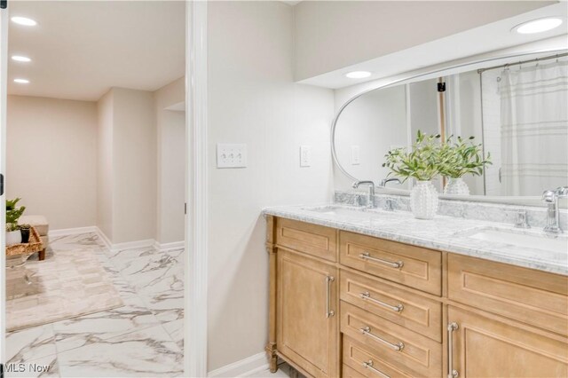 2332 Allison Rd, University Heights, OH 44118 - full bath featuring marble finish flooring, recessed lighting, double vanity, and baseboards