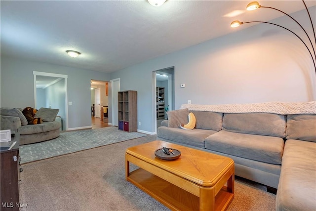 living room with carpet floors and baseboards