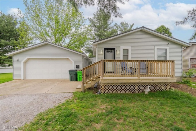 view of front of home with a detached garage, a front lawn, an outdoor structure, and a wooden deck