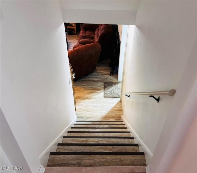 stairs with wood finished floors
