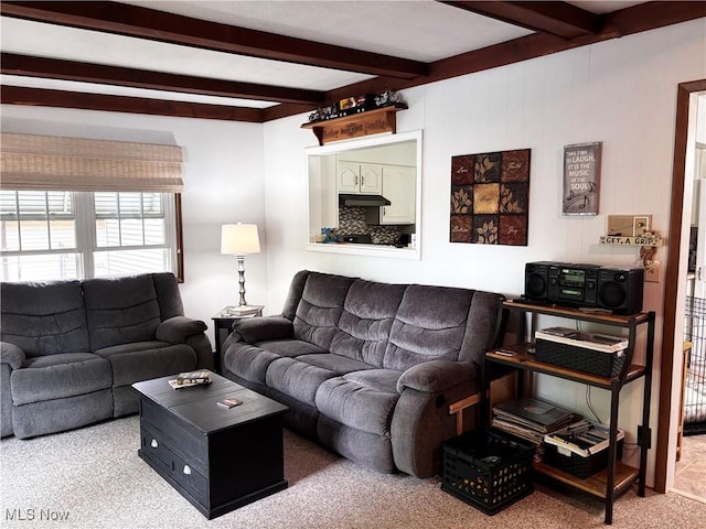 living room featuring carpet flooring and beam ceiling