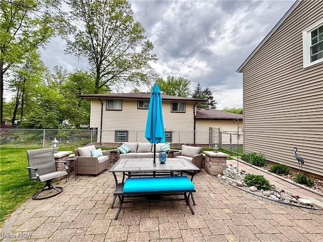 view of patio with outdoor lounge area and fence