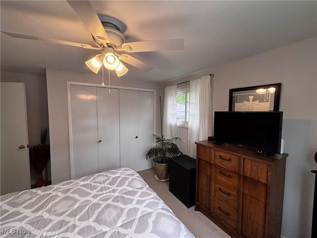 bedroom featuring a closet, carpet floors, and ceiling fan