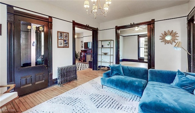 2963 Scranton Rd, Cleveland, OH 44113 - living room with hardwood / wood-style flooring and a chandelier