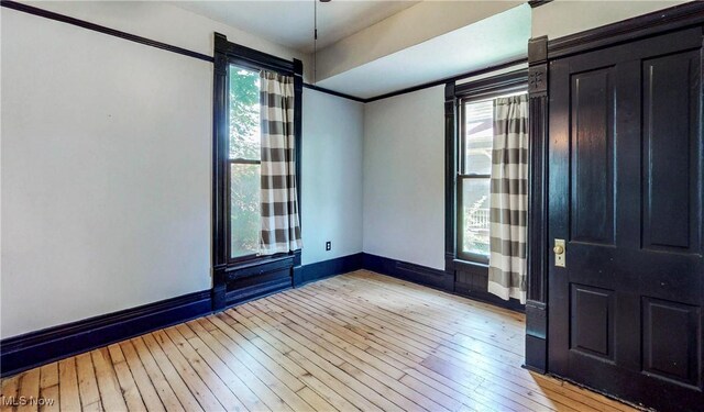 2963 Scranton Rd, Cleveland, OH 44113 - spare room with plenty of natural light, baseboards, and light wood-type flooring