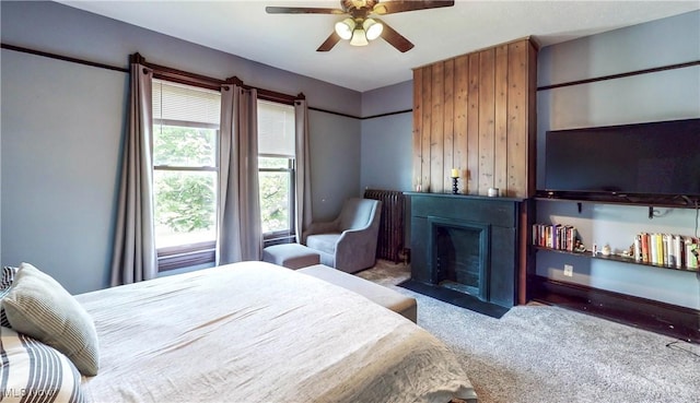 2963 Scranton Rd, Cleveland, OH 44113 - bedroom featuring carpet flooring, a fireplace with flush hearth, and a ceiling fan