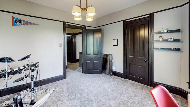 2963 Scranton Rd, Cleveland, OH 44113 - exercise area with light carpet, a chandelier, and baseboards