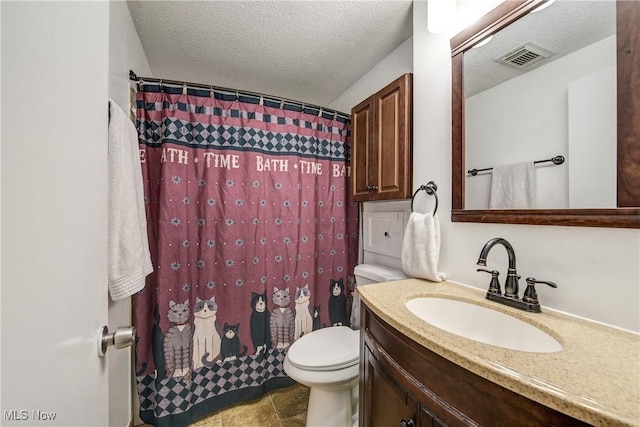 full bathroom featuring vanity, toilet, a textured ceiling, and curtained shower
