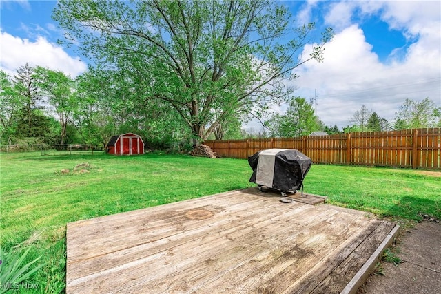 deck featuring a shed and an outbuilding