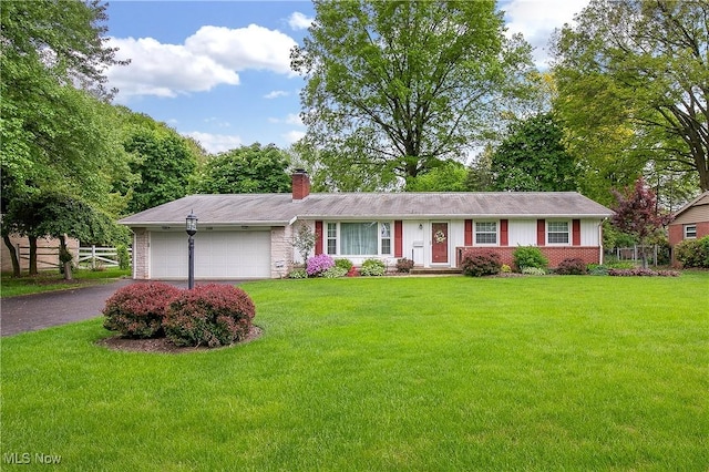 2406 Bevington St NW, Canton, OH 44709 - single story home featuring an attached garage, a chimney, driveway, and brick siding