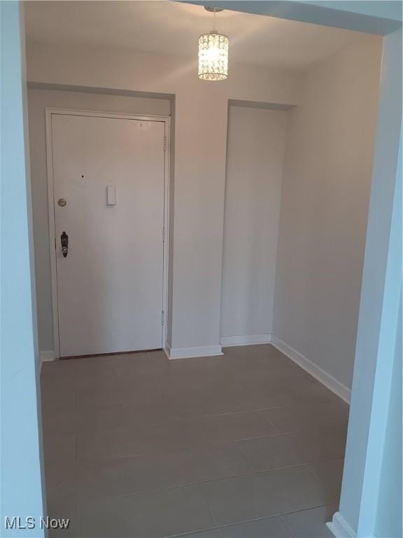 13800 Fairhill Rd Unit 515, Shaker Heights, OH 44120 - unfurnished dining area featuring baseboards and tile patterned floors