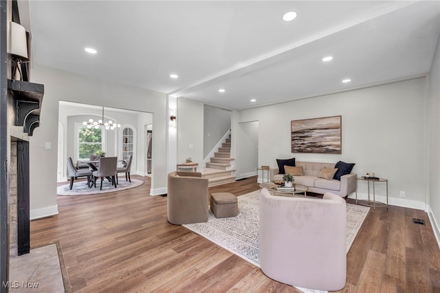 17617 Lomond Blvd, Shaker Heights, OH 44120 - living area featuring stairway, wood finished floors, recessed lighting, a chandelier, and baseboards