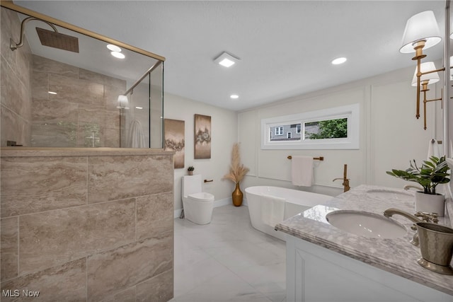 17617 Lomond Blvd, Shaker Heights, OH 44120 - bathroom featuring a stall shower, marble finish flooring, a soaking tub, double vanity, and recessed lighting