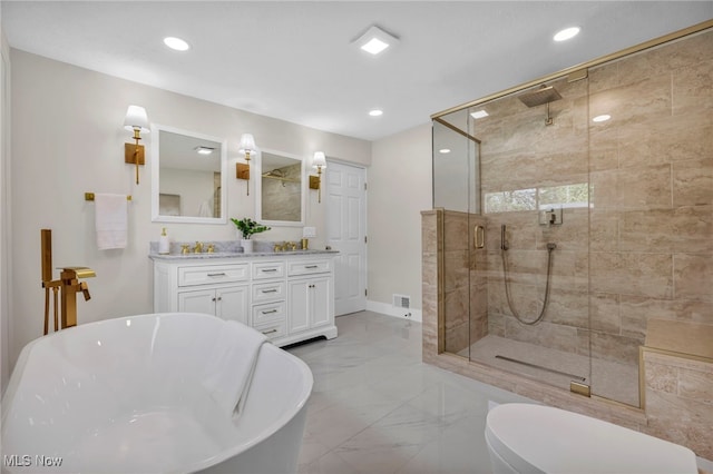 17617 Lomond Blvd, Shaker Heights, OH 44120 - full bathroom featuring marble finish flooring, a freestanding tub, a shower stall, double vanity, and baseboards