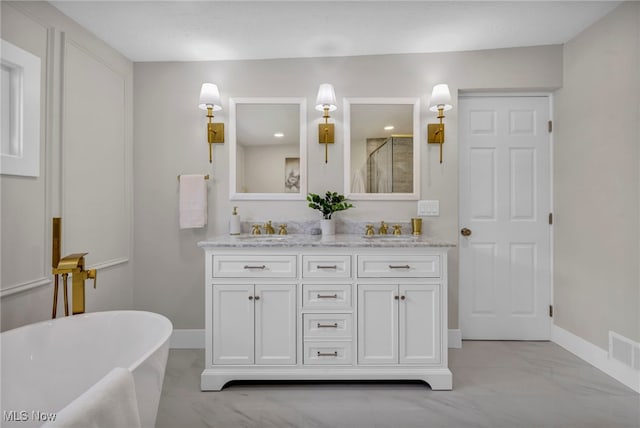 17617 Lomond Blvd, Shaker Heights, OH 44120 - bathroom featuring marble look tiles, double vanity, a stall shower, baseboards, and a soaking tub