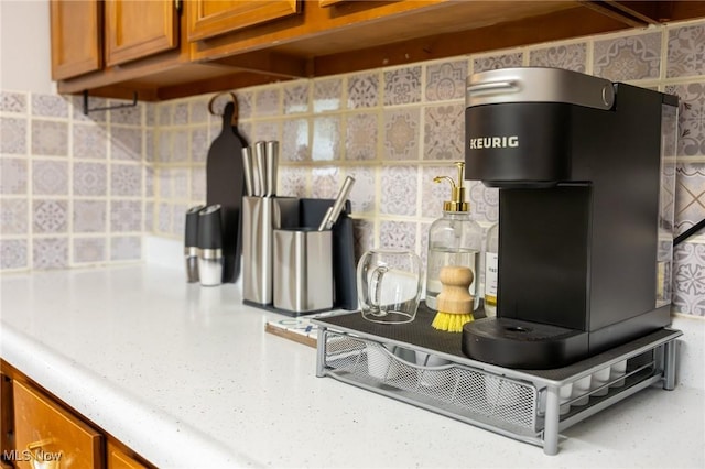 kitchen view of brown cabinets and decorative backsplash