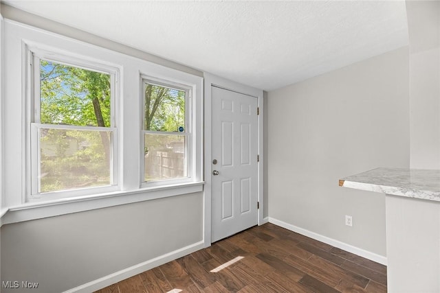1254 Delos St, Akron, OH 44306 - foyer with baseboards and dark wood finished floors