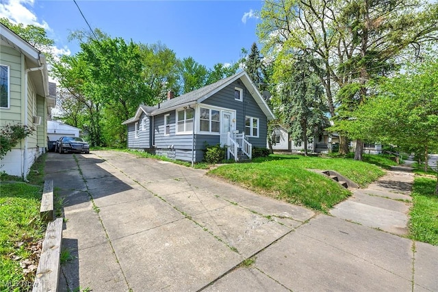 1254 Delos St, Akron, OH 44306 - view of home's exterior with a yard and a chimney