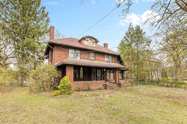 245 Merriman Rd, Akron, OH 44303 - back of property with a chimney, brick siding, and a porch