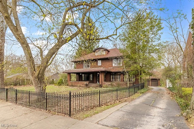 245 Merriman Rd, Akron, OH 44303 - view of front facade featuring a porch, asphalt driveway, and a fenced front yard