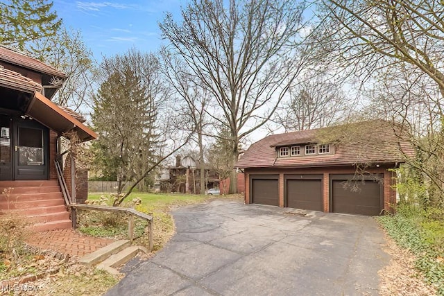 245 Merriman Rd, Akron, OH 44303 - view of home's exterior with an outbuilding
