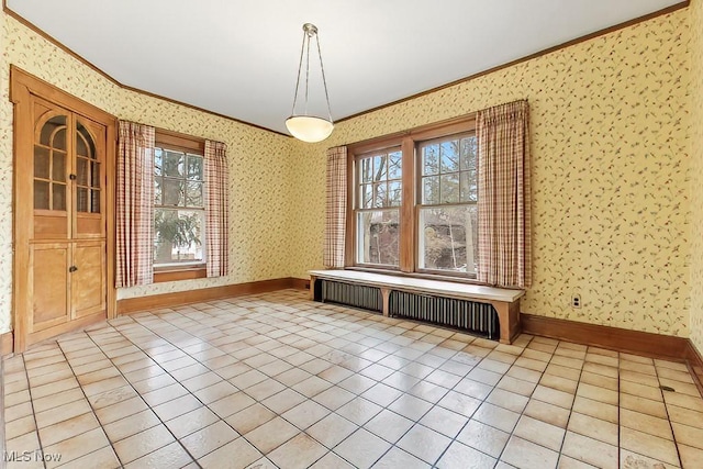245 Merriman Rd, Akron, OH 44303 - unfurnished dining area featuring wallpapered walls, ornamental molding, light tile patterned floors, plenty of natural light, and baseboards