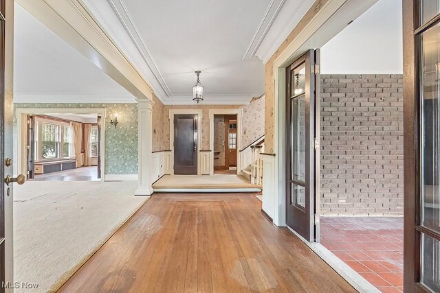 245 Merriman Rd, Akron, OH 44303 - hallway with crown molding, hardwood / wood-style floors, wainscoting, stairs, and wallpapered walls