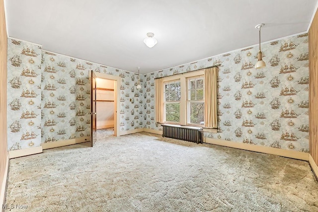 245 Merriman Rd, Akron, OH 44303 - spare room with radiator heating unit, carpet floors, wallpapered walls, and baseboards
