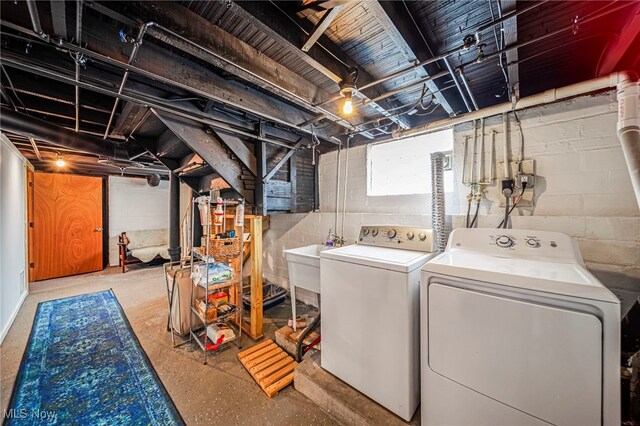 laundry area with washing machine and dryer