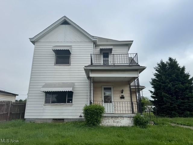 234 High Ave, Byesville, OH 43723 - rear view of property with a balcony and a porch