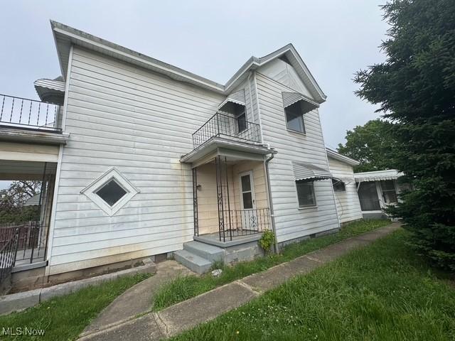 234 High Ave, Byesville, OH 43723 - view of front of property featuring a balcony