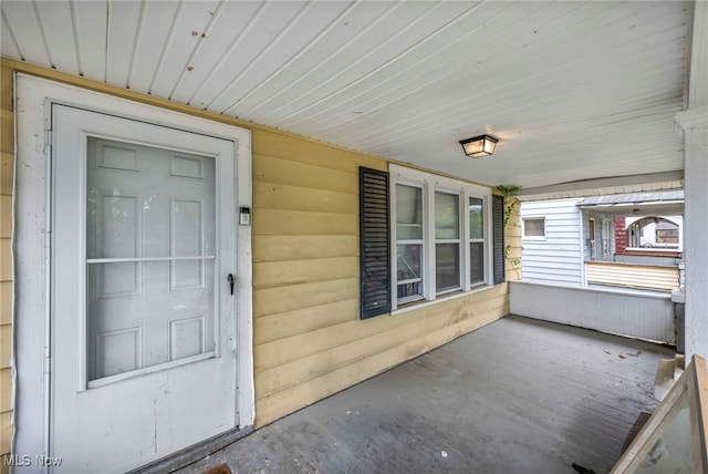 132 Irondale St, Elyria, OH 44035 - doorway to property featuring covered porch