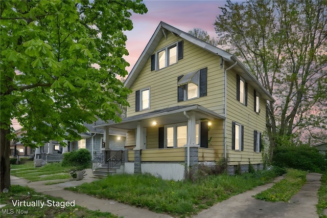 132 Irondale St, Elyria, OH 44035 - traditional style home featuring covered porch