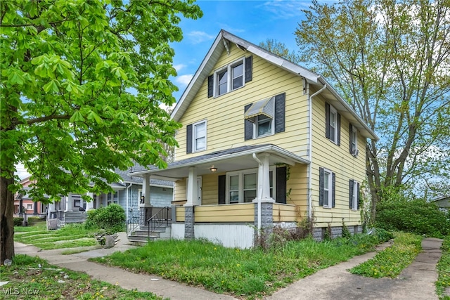 132 Irondale St, Elyria, OH 44035 - american foursquare style home featuring a porch