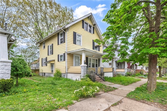 132 Irondale St, Elyria, OH 44035 - american foursquare style home featuring a porch