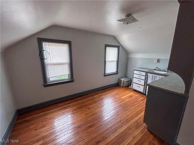 553 Willard Ave SE, Warren, OH 44483 - bonus room featuring light wood-type flooring and vaulted ceiling