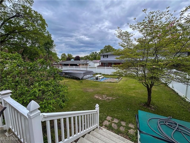 553 Willard Ave SE, Warren, OH 44483 - fenced backyard featuring a wooden deck