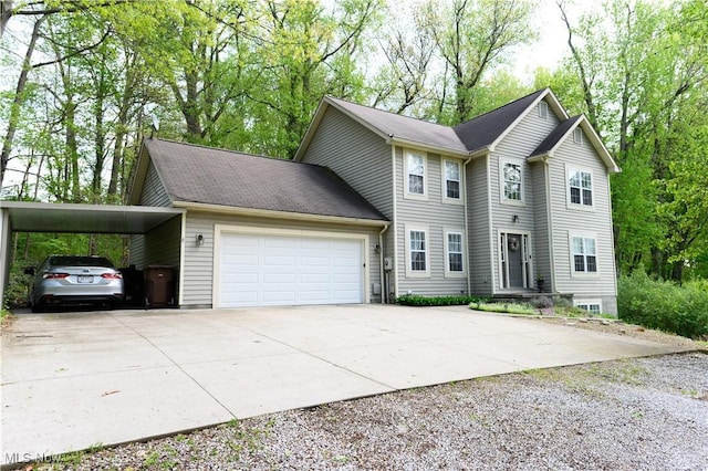 view of front of house with concrete driveway, a carport, and an attached garage