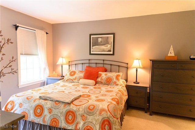 bedroom with light colored carpet