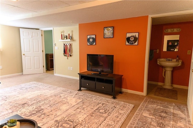 bedroom featuring carpet floors, baseboards, and ensuite bathroom