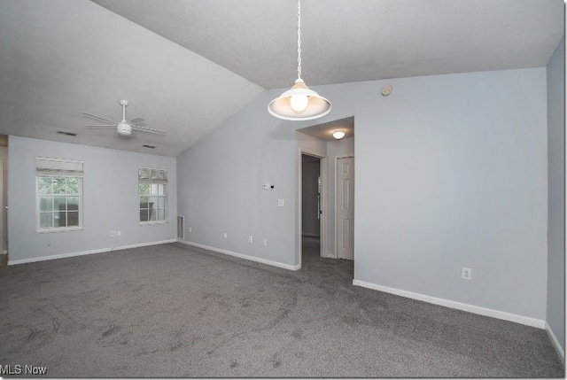 spare room with carpet flooring, baseboards, a ceiling fan, and lofted ceiling
