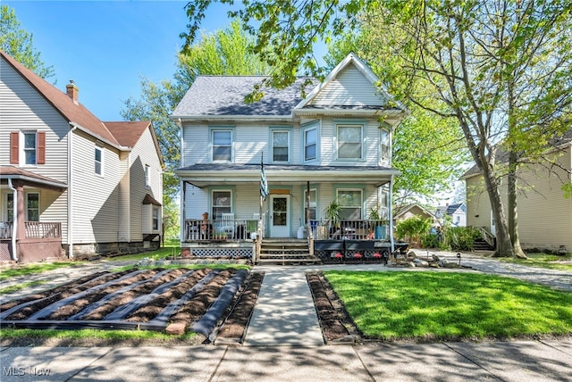 1821 E 30th St, Lorain, OH 44055 - view of front of house with a porch