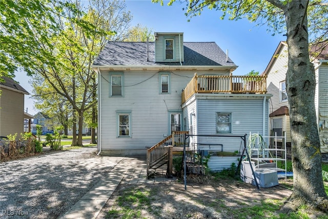 1821 E 30th St, Lorain, OH 44055 - rear view of house featuring a balcony and roof with shingles