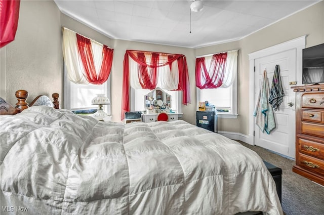 1821 E 30th St, Lorain, OH 44055 - bedroom featuring carpet, baseboards, and a ceiling fan