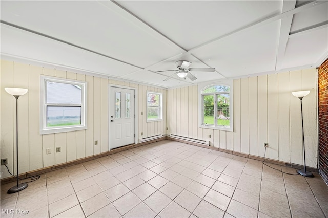 unfurnished sunroom featuring a baseboard heating unit