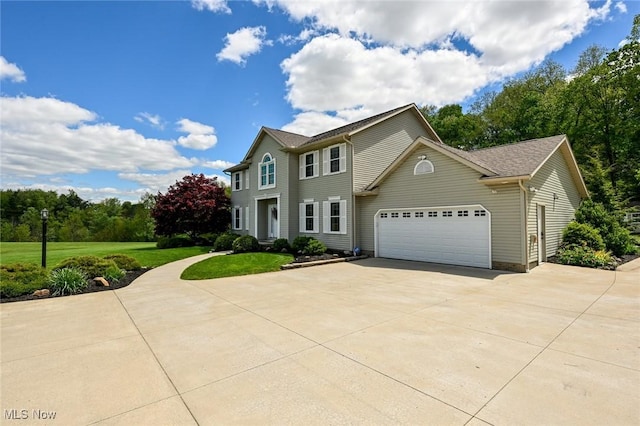 1152 Terraho Dr, Salem, OH 44460 - colonial-style house featuring driveway, an attached garage, and a front lawn